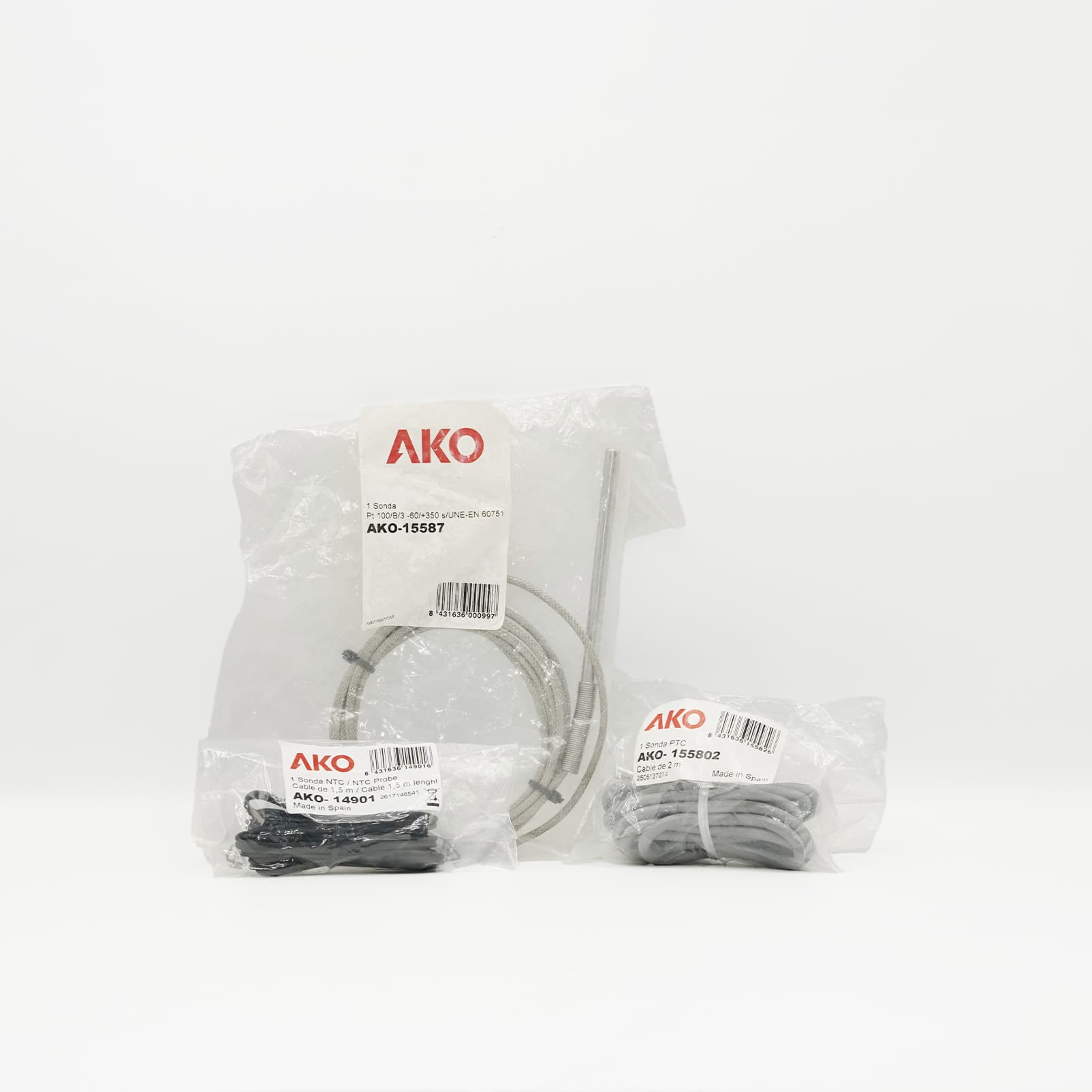 Sonde Pt100 AKO-15587 −60 à +350 °C avec câble 2 m Sonde Pt100 AKO-15587 au centre avec câble tressé, devant deux autres références AKO